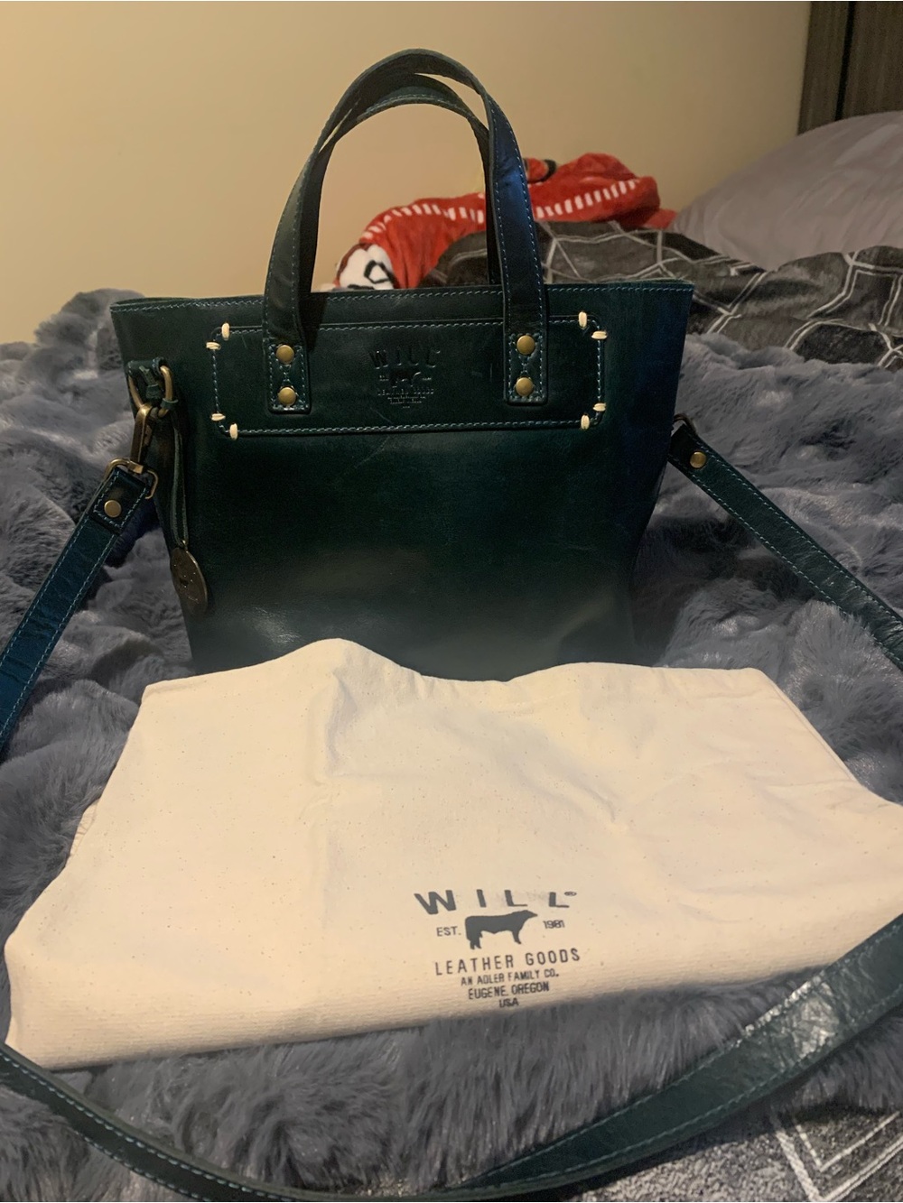 Will Leather Goods teal leather satchel with crossbody strap.